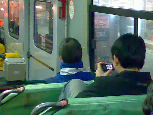 a person watching tv on his cellphone