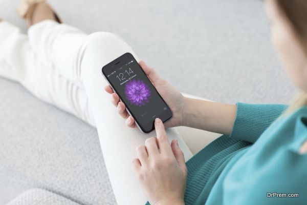 Woman holding iPhone 6 with unlock on the screen